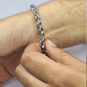 Silver braided stainless steel designer bracelet for men and women.