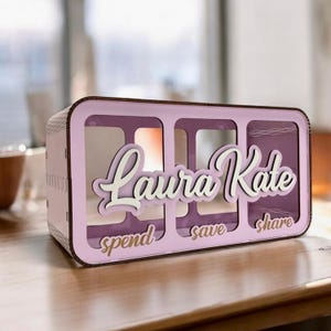May include: A set of three ceramic mugs with a speckled, matte finish. The mugs are in shades of cream, light gray, and dark gray. Each mug has a simple, minimalist design, perfect for coffee or tea.