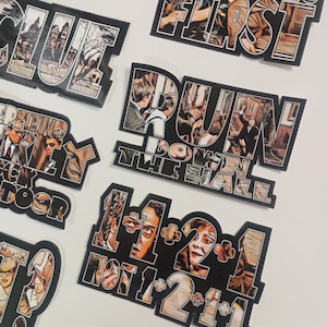 May include: A set of nine black and white stickers with images and text from the movie Clue. The stickers feature characters from the movie, including Miss Scarlet, Professor Plum, and Colonel Mustard. The text on the stickers includes phrases like "Ladies First", "Run Down the Hall", and "1+1=2+1 Not 1+2=1+1".