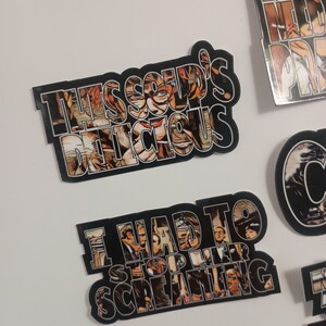 May include: Four black and white stickers with images of people and text. The text on the stickers reads "This soup's delicious", "I had to stop her screaming", "Most needed prayer", and "Flames".