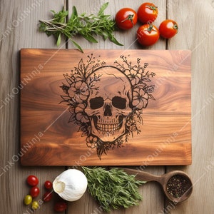 May include: A wooden cutting board with a floral design and a skull engraved in the center. The board is brown and has a natural wood grain.
