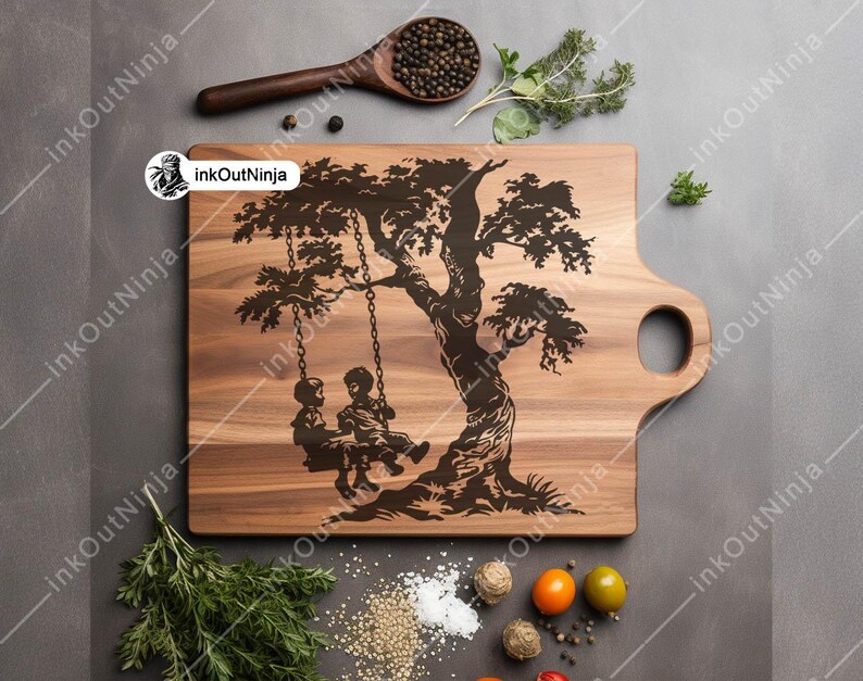 May include: A wooden cutting board with a carved design of a tree with two children on a swing. The board has a handle on the side.