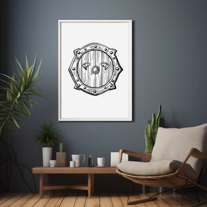 May include: A black and white line drawing of a round wooden shield with a central boss and metal accents. The shield is framed in a white frame and displayed on a dark blue wall.