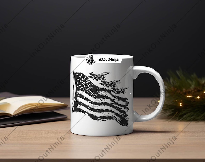 May include: White ceramic mug with a black and white graphic of an American flag with fighter jets flying over it. The text "InkOutNinja" is printed on the mug.