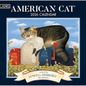 May include: A 2026 calendar titled "American Cat" features a tabby cat perched on U.S. mailboxes. The artwork by Lowell Herrero includes a red, beige, and blue mailbox with floral accents and a blue sky background.