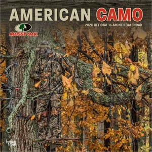 May include: A 2026 official 16-month calendar titled "American Camo" featuring a person in camouflage clothing in a forest setting. The calendar includes the Mossy Oak logo and is published by BrownTrout.
