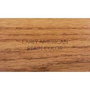 May include: A close-up of a wood grain surface stained in a warm, reddish-brown color. The text "EARLY AMERICAN STAIN COLOR" is printed in black on the surface.