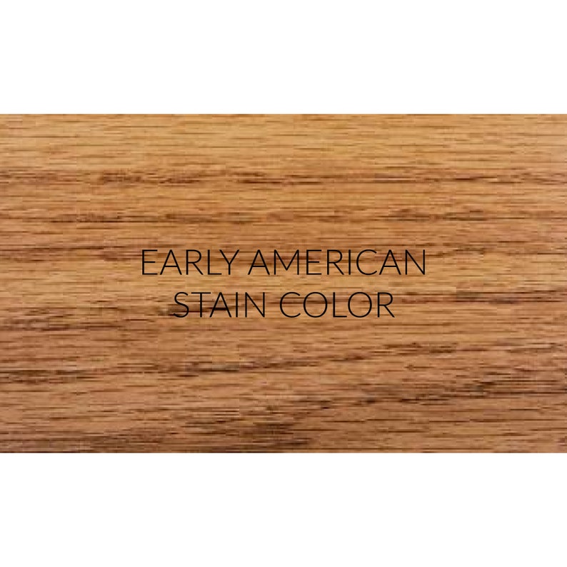 May include: A close-up of a wood grain surface stained in a warm, reddish-brown color. The text "EARLY AMERICAN STAIN COLOR" is printed in black on the surface.