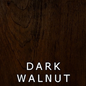 May include: A close-up of a dark walnut wood grain texture. The wood has a rich, dark brown color with a natural wood grain pattern.