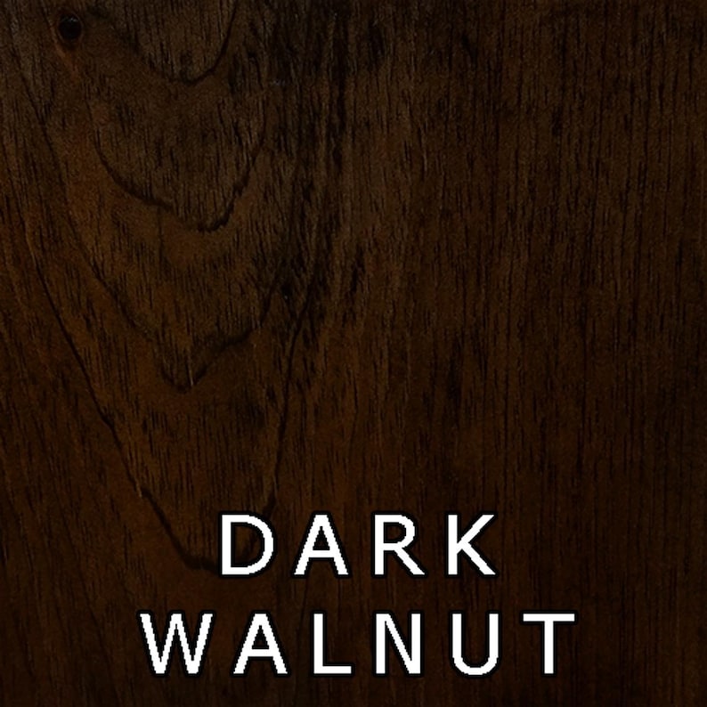 May include: A close-up of a dark walnut wood grain texture. The wood has a rich, dark brown color with a natural wood grain pattern.