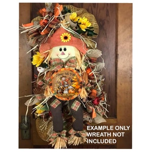 May include: A round, wooden sign with a fall-themed design featuring a scarecrow, pumpkins, and the text "Happy Fall Y'all".