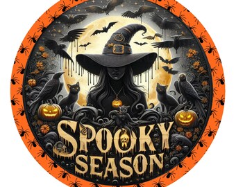 May include: A round orange and black Halloween-themed door hanger with a witch, bats, pumpkins, and the text "Spooky Season".