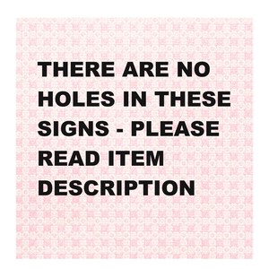 May include: A square sign with a pink and white patterned background. The black text reads: "THERE ARE NO HOLES IN THESE SIGNS - PLEASE READ ITEM DESCRIPTION."