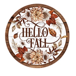May include: Round wooden sign with a white background and brown wood frame. The sign features a floral wreath with fall leaves and the text "HELLO FALL" in brown lettering.