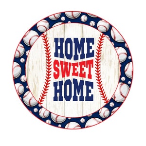 May include: A white wooden circle with a blue and white baseball pattern border. The center of the circle has a red and blue baseball stitch design with the text "HOME SWEET HOME" in red and blue.