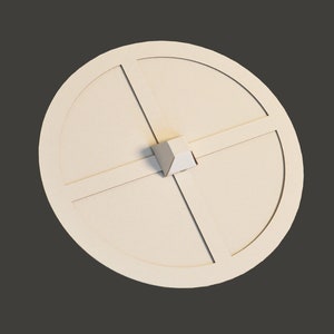 May include: A white cardboard circle with four evenly spaced lines forming a cross in the centre. A small white pyramid is centred on the cross.