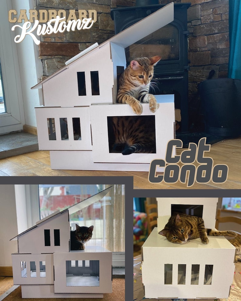 May include: A white cardboard cat condo with multiple levels and openings. A brown tabby cat is sitting on the top level, looking out of the condo. The condo is labeled "cat condo" in black text.