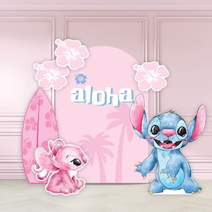 May include: A pink and blue themed party decoration set featuring cartoon characters, a surfboard, and hibiscus flowers. The word "aloha" is displayed in white letters against a pink backdrop. The set is designed for a tropical or Hawaiian-themed event.