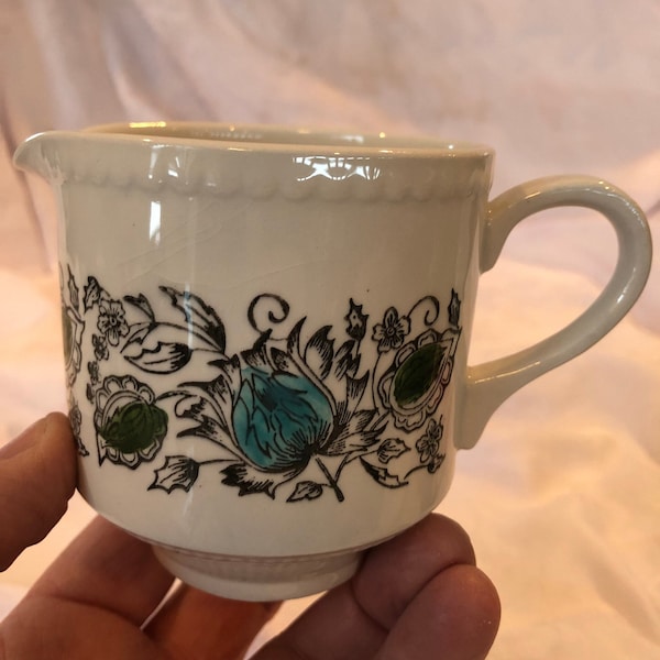 A vintage milk/ creamer designed by Kathie Winkle in the San Tropez pattern made by Broadhurst pottery England preowned in good condition.