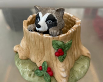 Vintage 1984 porcelain Woodland Surprises, figure "Racoon", showing a Racoon inside  a tree trunk. A collectable Franklin Porcelain group.