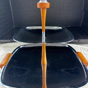 Chrome c 1960s 2 Tier Cake, Pastry , Sandwich , stand by Glow- Hill Canada, with Bakelite feet, handles & dowel posts, preowned good shape.
