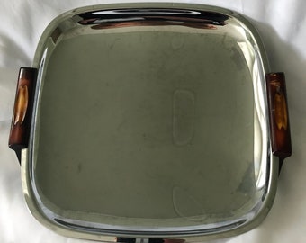 A Gourmates By Glo-Hill Canada  Pre-owned stainless Steel Serving platter on Amber tone Bakelite feet circa 1970 Mid Century Modern dining.