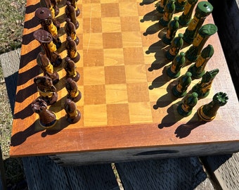 A vintage set of ceramic chess pieces hand painted under a hard glaze, the pieces are c 1980s and are in perfect condition preowned like new