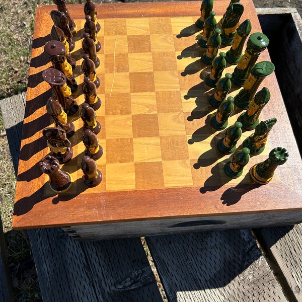 A vintage set of ceramic chess pieces hand painted under a hard glaze, the pieces are c 1980s and are in perfect condition preowned like new