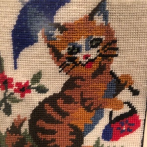 A vintage c1970s petit point in a Vintage  frame under glass, preowned and in excellent condition in a bevelled wood frame. Stylized Cat.