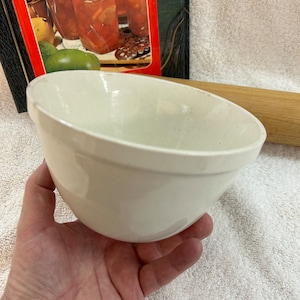 A antique Victorian Pudding Mixing bowl in white pottery finish, preowned and used the bowl has the mold mark 270 imprinted on the base.
