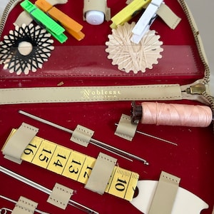 Vintage travel sewing kit made in Austria by Noblesse, preowned appears unused, leather pouch , velveteen interior c. 1970s excellent shape.
