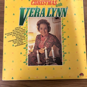 Vintage Christmas Record with Vera Lynn D.1976. A Very clean Record which does not appear to have had much play time a Christmas treasure.