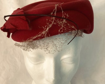 A Burgundy felt hat , preowned, made for Eatons of Canada C. 1950s Mid Century Modern Fashion Statement a rare Canadian Iconic fashion item.