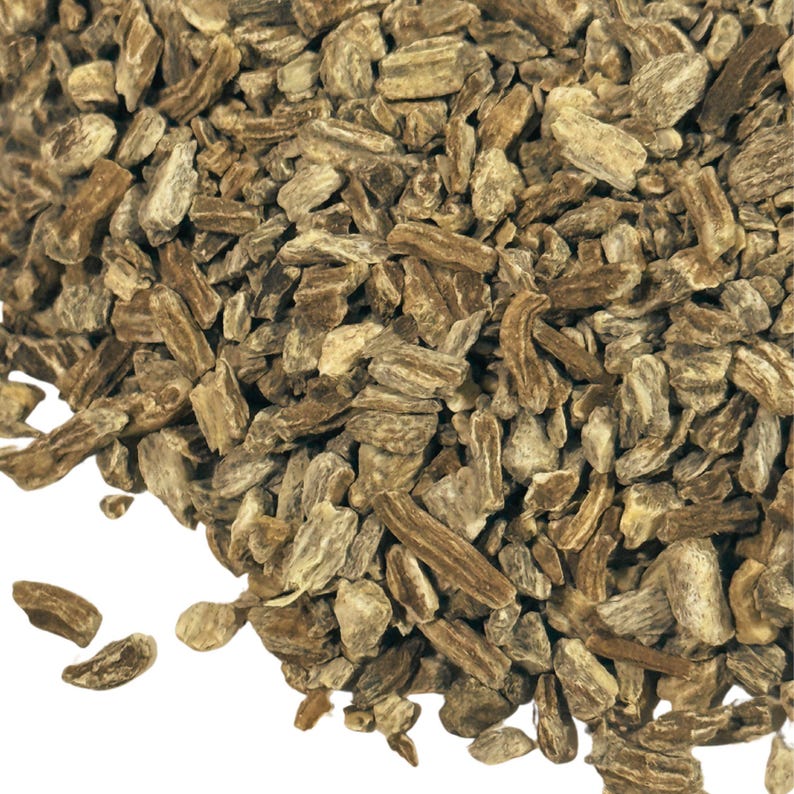 May include: Close-up of a pile of dried, brown, and beige burdock root pieces.