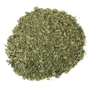 May include: A pile of dried green nettle leaves, a popular herb used in teas and cooking.