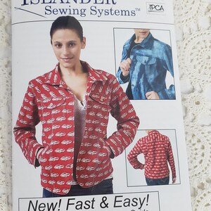 May include: A sewing pattern package for a jacket. The package features a woman wearing a red jacket with a white car pattern. The text reads "ISLANDER Sewing Systems" and "New! Fast & Easy!" Includes sizes XXS-4XL.