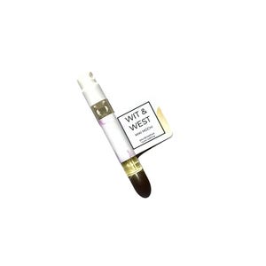 May include: A small perfume sample vial with a white cap and a clear glass body. The vial contains a light yellow liquid and is labeled "WIT & WEST MIKI MOCHI EAU DE PARFUM 1.5ml/0.05 fl oz."