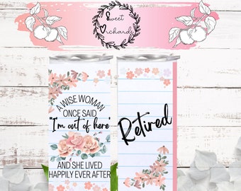 May include: A white tumbler with a pink floral design and the text "A wise woman once said "I'm out of here" and she lived happily ever after". The other side of the tumbler has a blue and white lined background with the word "Retired" in black.