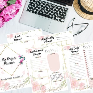 May include: A set of printable planner pages with floral designs. The pages include sections for goal setting, daily fitness, monthly planning, and daily tasks. The pages are designed to help you stay organized and on track with your goals.