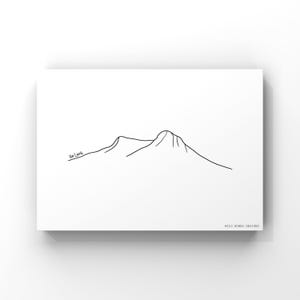 May include: Line art print of a mountain range with the text "Ha Long" at the bottom left corner. The print is on a white background and has the text "Wild Homes Designs" at the bottom right corner.