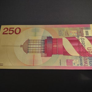 May include: A gold-colored banknote with a red and white lighthouse on the front. The denomination is 250 "gulden" and the text "de Nederlandsche Bank" is visible.