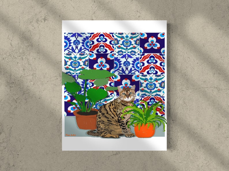 May include: A brown tabby cat sits in front of a wall with colourful patterned tiles. The cat is looking directly at the viewer. There are two potted plants on either side of the cat.