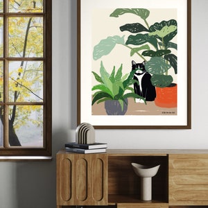 May include: A black and white cat sits in a pot of green plants. The cat is looking to the left of the image. The plants are in a room with a window and a wooden shelf. The text "FROM HERE" is at the bottom of the image.