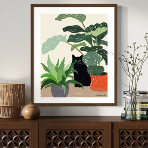 May include: A framed illustration of a black cat sitting in a pot of green plants. The cat is looking directly at the viewer. The background is a light beige color. The text "Studio No. 8" is in the bottom right corner of the image.