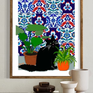 May include: A black cat sits in front of a wall covered in colourful patterned tiles. The cat is looking at the viewer. There are two potted plants in the image, one with green leaves and one with long, thin green leaves.