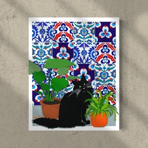 May include: A black cat sits in front of a wall with colourful patterned tiles. The cat is looking at the camera. There are two potted plants in the image, one with green leaves and one with green and brown leaves.