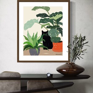 May include: A framed illustration of a black cat sitting in front of a potted plant. The cat is looking at the viewer. The illustration is on a beige background with the text "From Ruri" at the bottom.