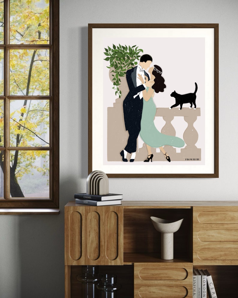May include: A digital illustration of a couple dancing on a balcony with a black cat watching them. The man is wearing a black tuxedo and the woman is wearing a teal dress. The background is a light pink color with a green plant in a pot.