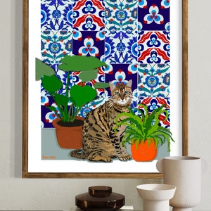 May include: A framed print of a tabby cat sitting in front of a tiled wall with two potted plants. The tiles are blue, red and white with intricate patterns. The print is signed "Fram Ru."