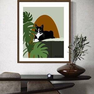 May include: A black and white cat with green eyes is lying on a green platform with a brown oval behind it. Green leafy plants are in the background. The text "FROM RURU" is at the bottom of the image.